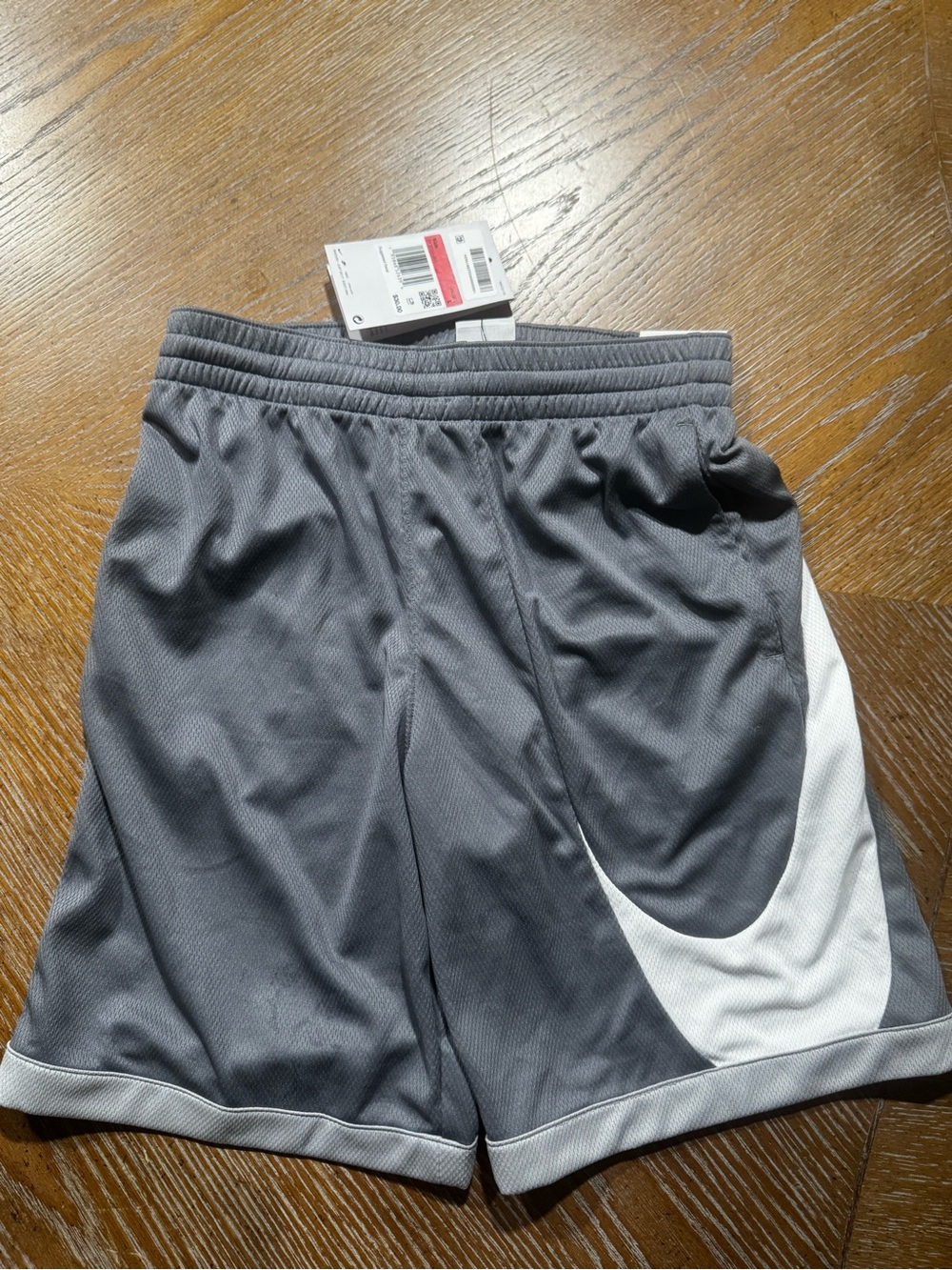 Gray Athletic Shorts with White Swoosh Accent Nike